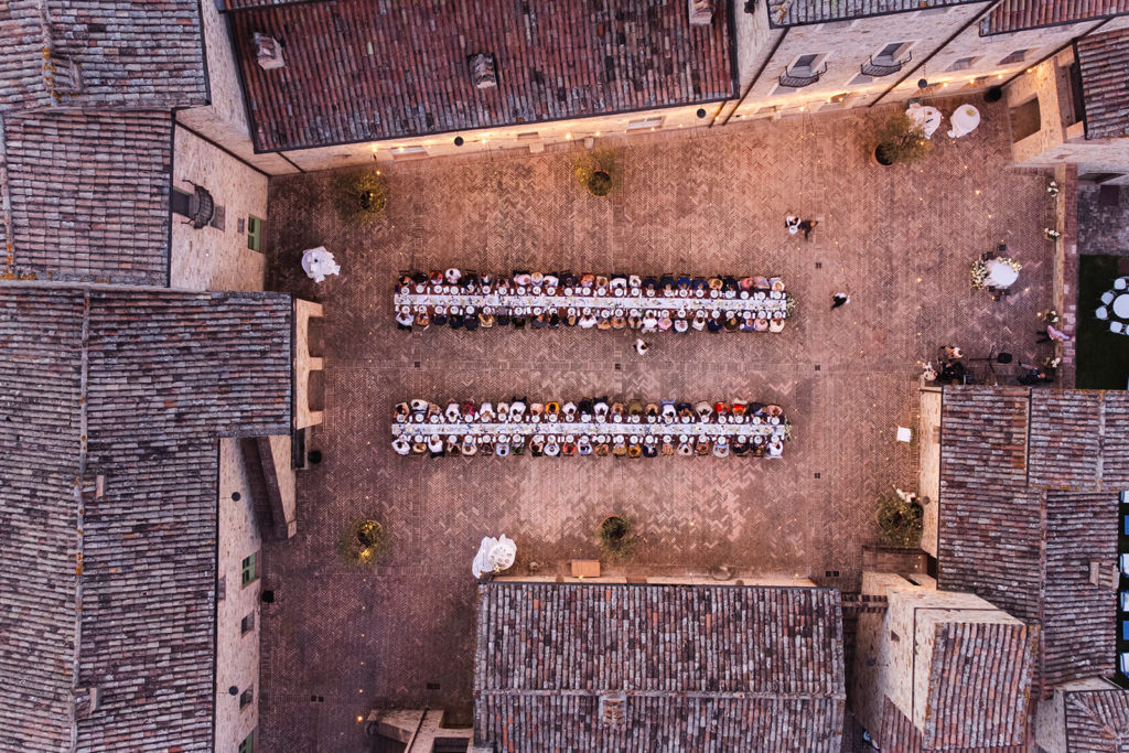View of the large square of SPAO Borgo San Pietro Aquaeortus set up for the wedding dinner